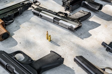 pistols-and-bullets-on-the-table-2023-11-27-05-12-44-utc